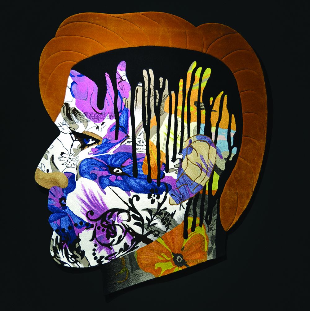 A colorful head shaped hand tufted wall carpet